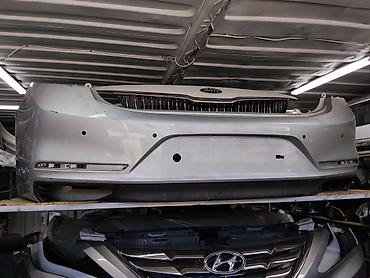 Передний бампер Kia (с решеткой радиатора). Особенности: - Цвет