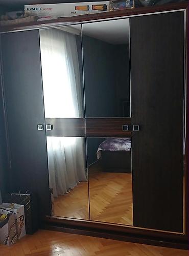 Geniş tutumlu, sürgülü qapılı şkaf - Material: ağac teksturasına malik lalafo.az -da Geniş tutumlu, sürgülü qapılı şkaf - Material: ağac teksturasına malik