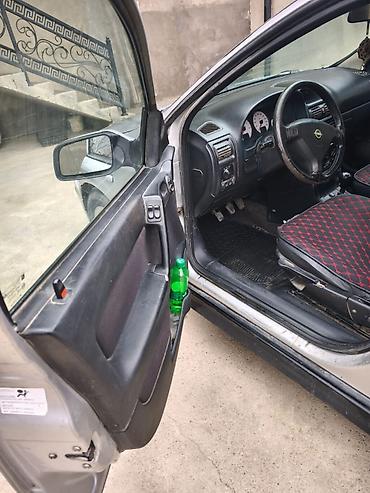 Opel: Opel Astra Caravan (universal) – gümüş rəngli kuzov, 5 qapı, dam — 11