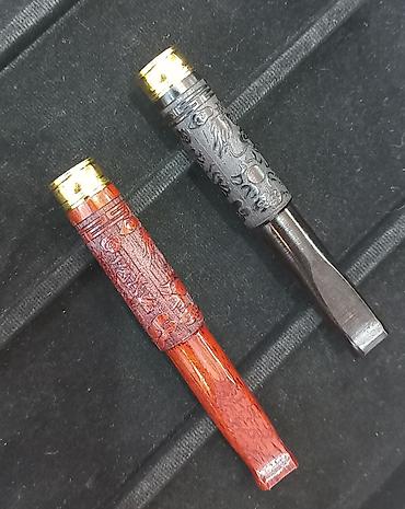 Зажигалки: Элегантный мундштук для сигарет, выполненный в темных тонах, с — 9