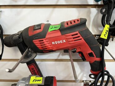 Отрезные диски: Ударная дрель Rodex в красно-черном корпусе. Имеет регулируемую
