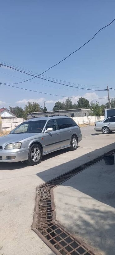 голыф 4: Subaru Legacy: 1999 г., 2.5 л, Механика, Газ, Универсал