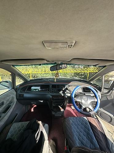 Другие детали салона: Honda — одиссей,салон минивэна. Основные особенности: - Просторный — 2