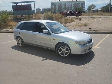 Унаа: Mazda 323: 2003 г., Кол менен иштөөчү, Бензин, Универсал — 3