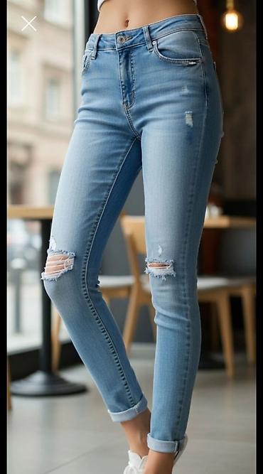 Ženske skinny farmerke – svetloplava isprana nijansa sa poderotinama na lalafo.rs Ženske skinny farmerke – svetloplava isprana nijansa sa poderotinama