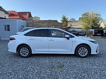 byd e1: Toyota Corolla: 2021 г., 1.8 л, Вариатор, Гибрид, Седан — 9