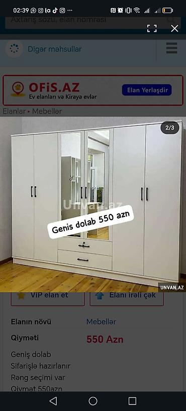 seyfi qapi: Daxili rəflər və asma yerləri olan, ağ rəngdə qarderob. Qarderobun — 8