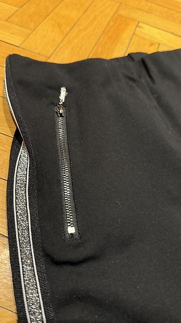 Pantalone, Farmerke, Šortsevi: Crne ženske helanke/pantalone uskog kroja sa dekorativnim srebrnim — 1