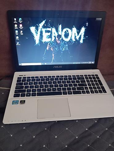 ASUS noutbuk – 15.6" ekranlı, ağ korpuslu model. Klaviaturası tam