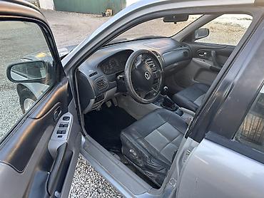 Mazda: Mazda 323: 2002 г., 1.6 л, Механика, Бензин, Универсал — 7