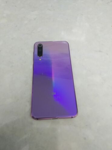 xiaomi mi 9 se 2020: Xiaomi Mi 9 SE, 64 GB, rəng - Bənövşəyi, 
 İki sim kartlı, Simsiz şarj, Face ID