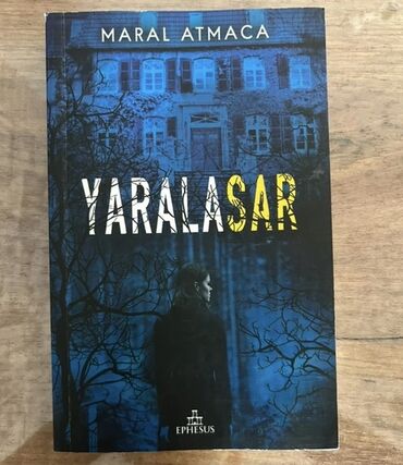 Bədii ədəbiyyat: Maral Atmaca tərəfindən "Yaralasar" adlı kitab. Kitabın üz qabığında