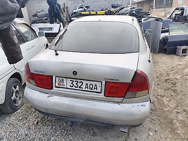 Крышки багажника и комплектующие: Крышка багажника Mazda, Оригинал — 16