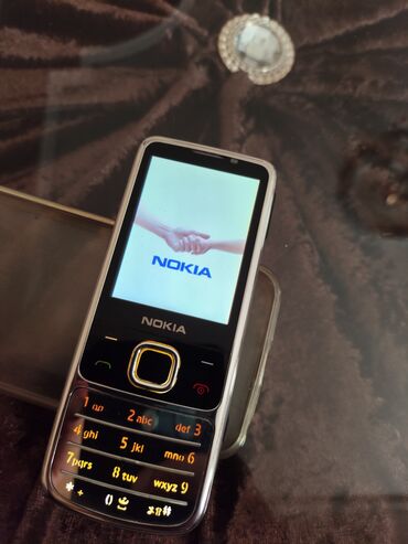 Nokia: Nokia 6700 Slide, 8 GB, rəng - Gümüşü, Düyməli