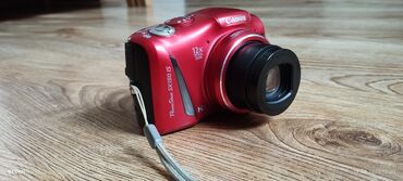 купить фотоаппарат маленький: Компактная цифровая фотокамера Canon PowerShot SX150 IS ярко-красного
