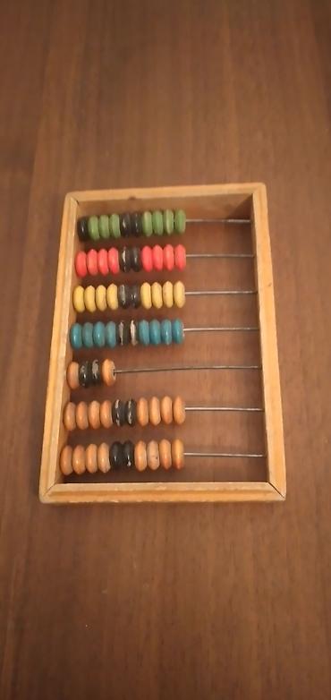 Taxta çərçivəli, metal çubuqlu rəngli sayğac (abakus). - Material