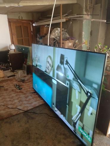 samsung a03: Телевизор LED, диагональ около 55–60". Тонкие рамки, устойчивые ножки — 3