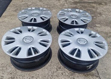 Gume i felne: Komplet od 4 čelične felne sa originalnim Opel ratkapama. - na lalafo.rs — 4 Gume i felne: Komplet od 4 čelične felne sa originalnim Opel ratkapama. - — 4