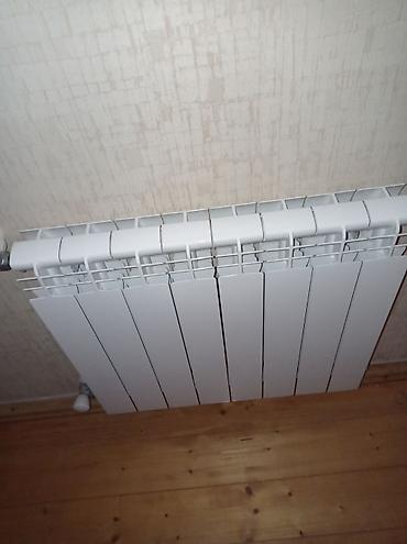 Ремонт и строительство: Ağ rəngli bərk materialdan hazırlanmış bölməli radiator (su/qazanxana — 1