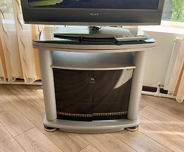 ref: TV stendi - Material: möhkəm korpus, üst hissədə şüşə səth - Rəng — 1