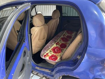 самые дешёвые машины: Автомобиль Daewoo Matiz синего цвета с пятидверным кузовом хэтчбек