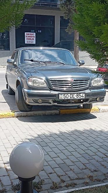 volga 2110: GAZ Volga 31105 sedan - Kuzov: 4 qapılı sedan, tünd boz rəng, xrom ön — 5