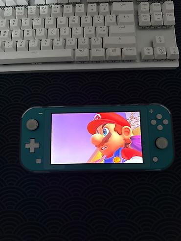 купить свитч лайт: Nintendo Switch Lite, бирюзовый цвет. Прошитая. В идеальном состоянии — 1