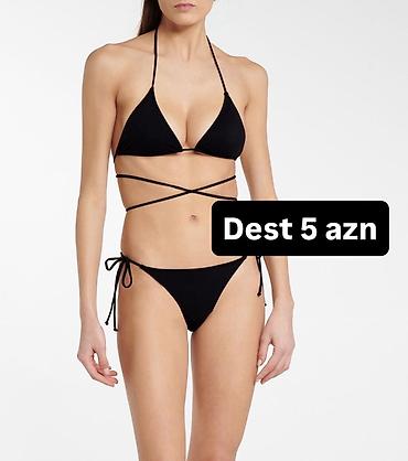 Çimərlik geyimləri: Qara bikini dəsti - Üst hissə: üçbucaq kəsimli, boyundan bağlanan və — 1