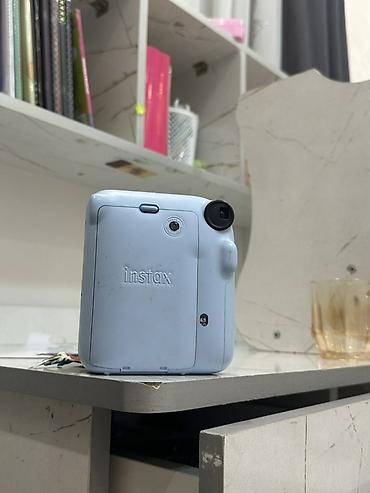 Фото и видеокамеры: Мгновенная камера Fujifilm Instax mini 12, цвет Pastel Blue. - Формат — 1