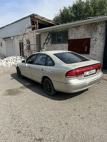 Транспорт: Mazda Cronos: 1993 г., Механика, Бензин, Седан — 6