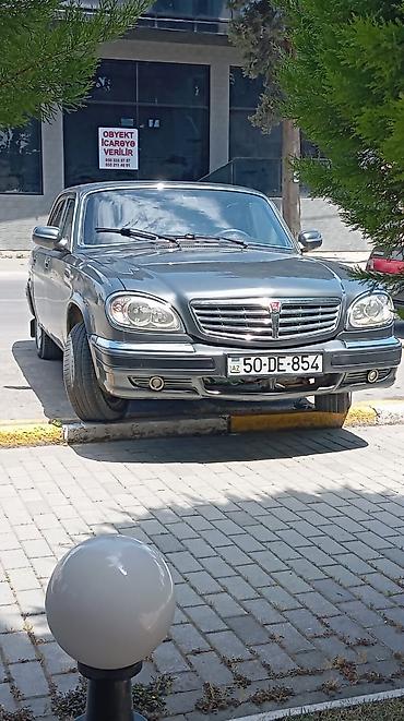 volga 2110: GAZ Volga 31105 sedan - Kuzov: 4 qapılı sedan, tünd boz rəng, xrom ön — 2