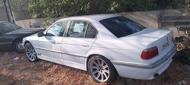 диски на бмв 5 серии: BMW 7 Series (E38) sedan – ağ rəng, 4 qapı, arxa ötürücülü lüks sinif