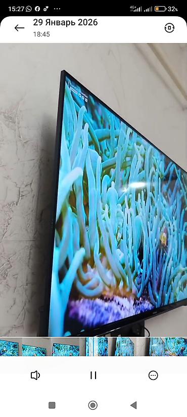 Телевизоры: Телевизор KIVI (надпись на рамке) с тонкими рамками, настенное — 10