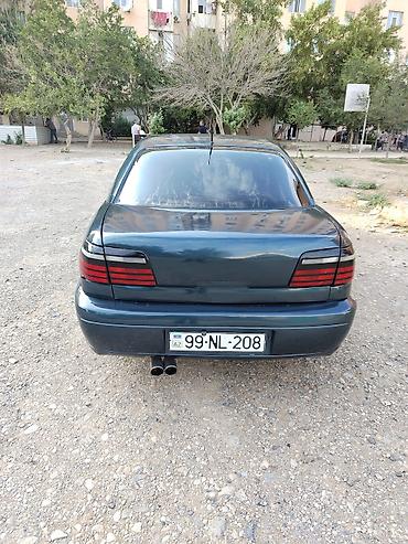 фольксваген поло л с: Opel Omega B sedan - Kuzov: 4 qapılı sedan, tünd yaşıl rəng - — 1