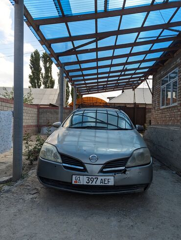 продаю участок или меняю на авто: Nissan Primera в кузове универсал. Автомобиль серого цвета, оснащен
