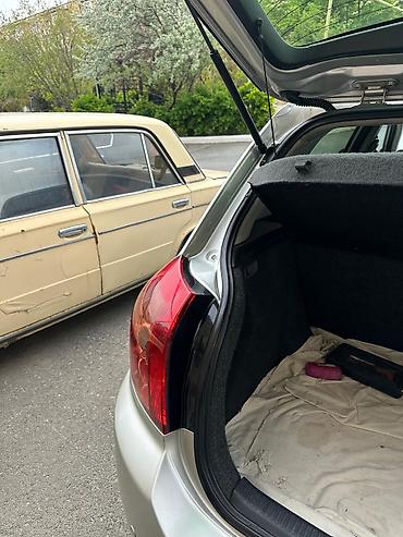 Toyota: Toyota Corolla hatchback (E120), gümüşü rəng. - Kuzov: 5 qapılı — 15