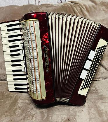 Аккордеоны: Аккордеон Weltmeister (кнопочно-клавишный), красный перламутровый — 10