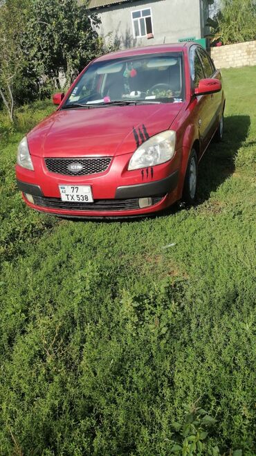 Kia: Kia Pride: 1.5 l | 2006 il Sedan — 12