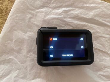 фотографы: Экшн-камера DJI Osmo Action 4 черного цвета, предназначенная для