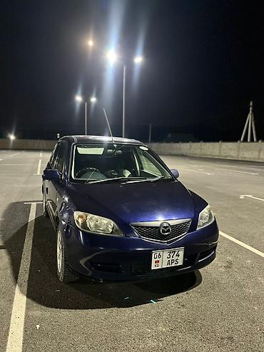 рул: Mazda Demio: 2002 г., 1.3 л, Автомат, Бензин, Хетчбек — 1