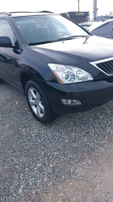 купить багажник на крышу авто в бишкеке: Черный кроссовер Lexus RX, оснащенный литыми дисками. Автомобиль имеет