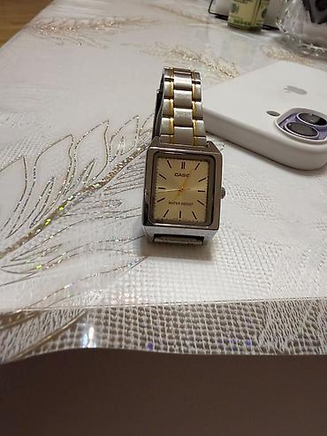 Casio kişi qadin qol saatı - Korpus: düzbucaqlı, paslanmayan polad -