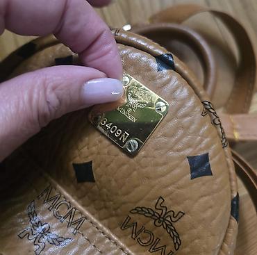 Modni rančevi: MCM mini stark ranac konjak braon boje sa monogram printom. Nov je — 8