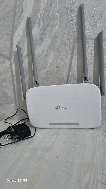 Wi‑Fi роутер TP‑Link с четырьмя внешними антеннами. Основные