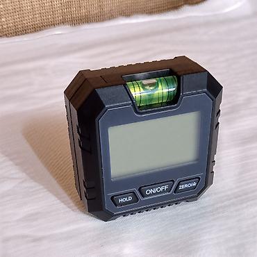 Laserski daljinomeri: Nov digitalni uglomer. Ima sa donje strane magnete, ima dugme da — 12