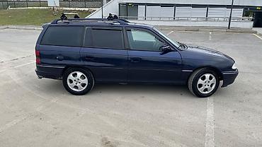 e39 rul: Opel Astra F Caravan (universa) – tünd mavi rəngdə, nömrə 10-RG-592 — 3