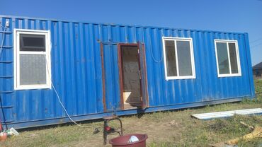 дом контейнера: Модульное здание синего цвета, изготовленное из морского контейнера