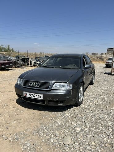 тайота хайландыр: Седан Audi A6 тёмно-серого цвета, который выделяется своей