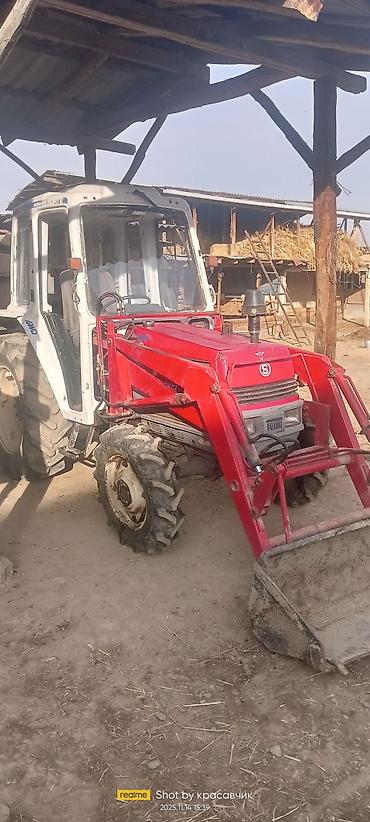 Тракторы ДТ-75: Трактор с фронтальным погрузчиком и навесным оборудованием Описание — 8