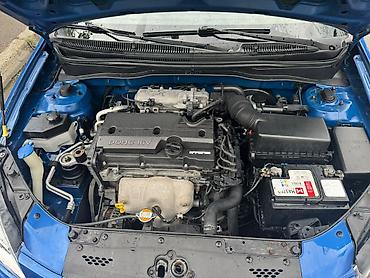 Kia: Kia Rio hetçbek, mavi rəngdə. Avtomobilin кузов tipi 5 qapılı — 11